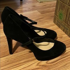 Woman’s Black Suede  Vince Camuto Mary Jane pumps.